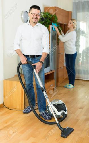 Man and his wife cleaning at home